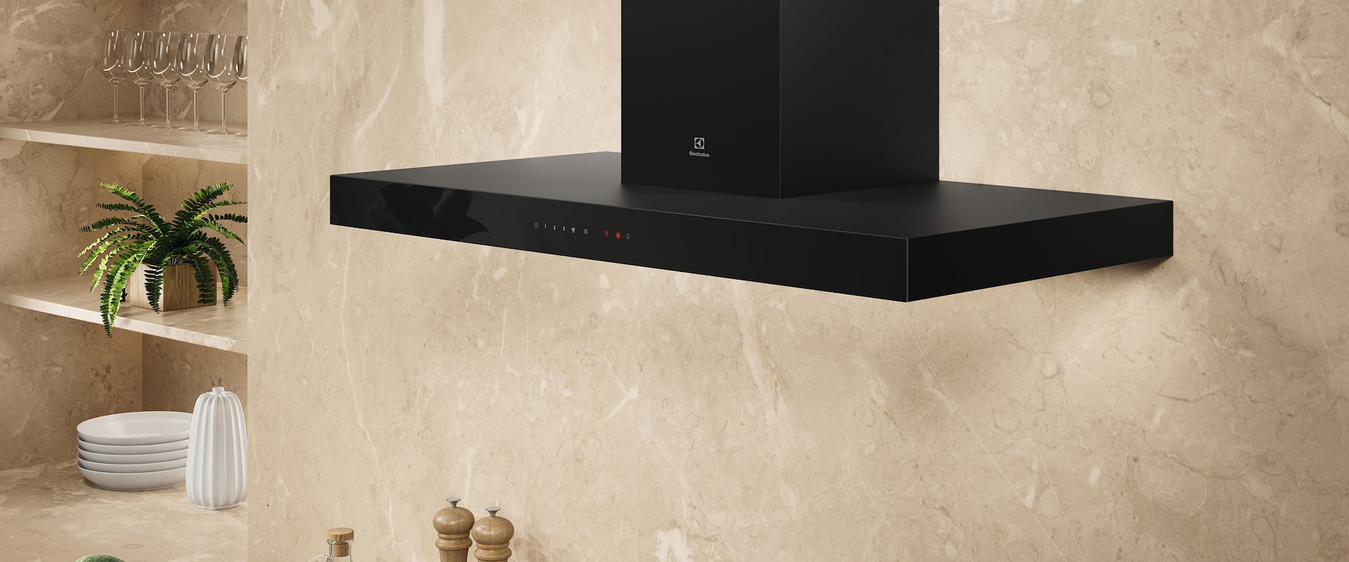 En sort emhætte placeret på en beige væg i et køkken.